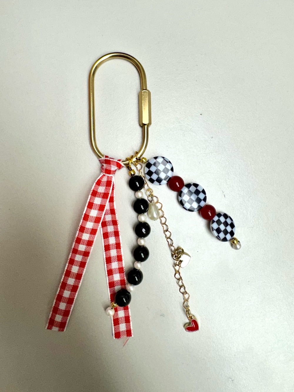 Checkered black, white and red bag charm keychain